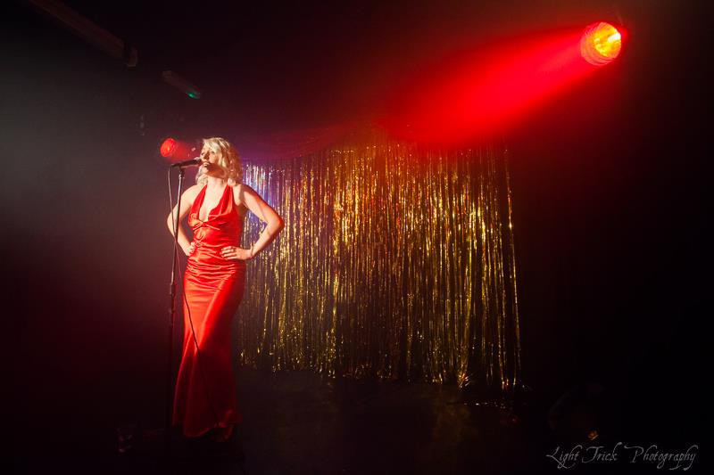 Corrinne Williams red dress lounge singing picture